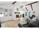 Spacious living room with exposed beams, a cozy fireplace, and built-in shelving, creating a comfortable atmosphere at 119 Savannah Round, Summerville, SC 29485