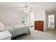Serene bedroom featuring soft carpeting, a ceiling fan, and natural light, creating a peaceful retreat at 119 Savannah Round, Summerville, SC 29485
