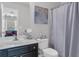 The bathroom features a vanity sink, decorative painting, toilet, and shower at 122 Brockman Way, Goose Creek, SC 29445