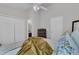 Bright bedroom featuring a ceiling fan, plush bedding, and ample closet space at 122 Brockman Way, Goose Creek, SC 29445