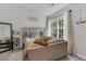 Bright bedroom featuring a large window, comfortable bed, and neutral decor at 122 Brockman Way, Goose Creek, SC 29445