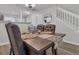Inviting dining room featuring a modern table and chairs with an open view to kitchen at 122 Brockman Way, Goose Creek, SC 29445