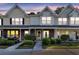 Charming townhome with well-manicured front yard landscaping and inviting covered porch at 122 Brockman Way, Goose Creek, SC 29445