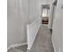 Upstairs hallway featuring carpeted floors and railing leading to the bedrooms at 122 Brockman Way, Goose Creek, SC 29445