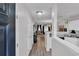 Inviting hallway flowing into a kitchen and living area with stylish laminate flooring at 122 Brockman Way, Goose Creek, SC 29445