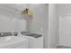 Functional laundry room with modern washer, dryer and practical shelving at 122 Brockman Way, Goose Creek, SC 29445