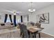 Open-concept living and dining area with stylish decor and natural light from sliding glass door at 122 Brockman Way, Goose Creek, SC 29445