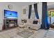 Inviting living room with decorative fireplace, comfortable seating, and stylish decor at 122 Brockman Way, Goose Creek, SC 29445