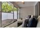 Covered patio featuring comfortable seating with decorative pillows and a view of the backyard at 122 Brockman Way, Goose Creek, SC 29445