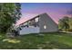 View of the rear exterior with fenced in backyards and lush green grass at 122 Brockman Way, Goose Creek, SC 29445