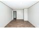A simple bedroom features hardwood floors, neutral walls, and white trim at 1330 Whitehouse Rd, Summerville, SC 29486