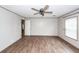 Spacious bedroom with neutral walls, ceiling fan, and wood-look floors offer a cozy atmosphere at 1330 Whitehouse Rd, Summerville, SC 29486