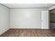 Bright bedroom with hardwood flooring and a white door leading to another room at 1330 Whitehouse Rd, Summerville, SC 29486