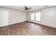 Bright bedroom featuring wood-look floors, a ceiling fan, and natural light from two windows at 1330 Whitehouse Rd, Summerville, SC 29486