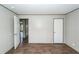 Neutral bedroom with hardwood floors, white doors, and ample natural light at 1330 Whitehouse Rd, Summerville, SC 29486