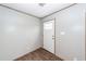 Clean entryway featuring wood-look floors and a white door, offering a simple and inviting welcome at 1330 Whitehouse Rd, Summerville, SC 29486