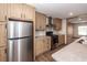 Bright kitchen featuring stainless steel appliances, light wood cabinets, and durable countertops at 1330 Whitehouse Rd, Summerville, SC 29486