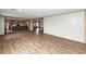 Spacious living area with modern wood-look flooring, open layout to the kitchen, and abundant natural light at 1330 Whitehouse Rd, Summerville, SC 29486