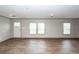 Open concept living space with wood-look floors, bright windows, and smooth transition to the entryway at 1330 Whitehouse Rd, Summerville, SC 29486