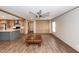 An open-concept living space with a kitchen island, wood-look floors, and bright natural light at 1330 Whitehouse Rd, Summerville, SC 29486