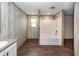 Bathroom featuring wood-look floors, shower/tub combo, and light grey walls at 1330 Whitehouse Rd, Summerville, SC 29486
