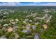 Scenic aerial view of a residential neighborhood featuring beautiful homes surrounded by lush trees and ponds at 1500 Trumpet Vine Ct, Mount Pleasant, SC 29464