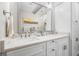 Bright bathroom featuring double sinks with a marble countertop and white cabinetry at 1500 Trumpet Vine Ct, Mount Pleasant, SC 29464