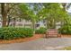 Beautiful townhouses with private garages, accessed by outdoor stairways and walkways amid lush landscaping at 1500 Trumpet Vine Ct, Mount Pleasant, SC 29464