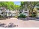 Charming exterior view of townhomes featuring private garages, elevated entrances and lush landscaping at 1500 Trumpet Vine Ct, Mount Pleasant, SC 29464