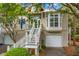Charming elevated home with inviting white staircase and garage at 1500 Trumpet Vine Ct, Mount Pleasant, SC 29464