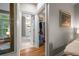 Hallway view of the bathroom and walk-in closet with custom shelving at 1500 Trumpet Vine Ct, Mount Pleasant, SC 29464
