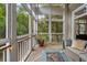 Charming sunroom with comfortable seating, modern fire pit, and tranquil views of nature at 1500 Trumpet Vine Ct, Mount Pleasant, SC 29464