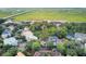 Aerial view of a neighborhood with lush trees and marshlands with bridge in the background at 1500 Trumpet Vine Ct, Mount Pleasant, SC 29464