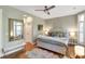 Comfortable bedroom with hardwood floors, a large window, and a cozy bench at 1500 Trumpet Vine Ct, Mount Pleasant, SC 29464