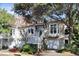 Charming two-story home with white exterior and a well-manicured front yard at 1500 Trumpet Vine Ct, Mount Pleasant, SC 29464