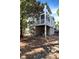 View of the home's exterior showing the balcony and ground level at 1500 Trumpet Vine Ct, Mount Pleasant, SC 29464