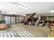 Large garage featuring garage door, wooden staircase, concrete floor, and ample storage space at 1500 Trumpet Vine Ct, Mount Pleasant, SC 29464