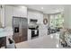 Modern kitchen with white cabinets, stainless steel appliances, quartz countertops, and a cozy breakfast nook at 1500 Trumpet Vine Ct, Mount Pleasant, SC 29464
