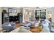 Cozy living room featuring hardwood floors, neutral walls, stylish furniture, and access to the outdoor patio at 1500 Trumpet Vine Ct, Mount Pleasant, SC 29464