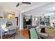 Inviting open-concept space featuring hardwood floors, neutral walls, large windows, and a comfortable lounge and office space at 1500 Trumpet Vine Ct, Mount Pleasant, SC 29464