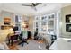 Bright office space featuring hardwood floors, neutral walls, large windows, and two functional work areas at 1500 Trumpet Vine Ct, Mount Pleasant, SC 29464