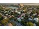 Captivating aerial view showcasing the property's location near a lake, buildings, and lush greenery at 154 Wentworth St, Charleston, SC 29401