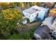 A charming light blue home with a rooftop deck, surrounded by lush greenery and neighborhood views from above at 154 Wentworth St, Charleston, SC 29401