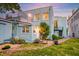 Spacious backyard with brick path, green grass, blue home, and a satellite dish at 154 Wentworth St, Charleston, SC 29401