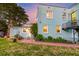 Backyard featuring a lush green lawn, outdoor stairs, and a shed at 154 Wentworth St, Charleston, SC 29401