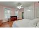 Bright bedroom features hardwood floors, ceiling fan, closet space and dresser at 154 Wentworth St, Charleston, SC 29401