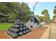Historic cannon and cannonballs displayed outdoors, showcasing a slice of military history in a park setting at 154 Wentworth St, Charleston, SC 29401