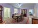 Formal dining room with a large table, china cabinet, and view into other rooms at 154 Wentworth St, Charleston, SC 29401