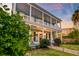 Two-story home with covered porch, columns and manicured yard at 154 Wentworth St, Charleston, SC 29401