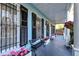 Inviting front porch with blue ceilings, decorative ironwork, and pink flower boxes creating a welcoming entrance at 154 Wentworth St, Charleston, SC 29401